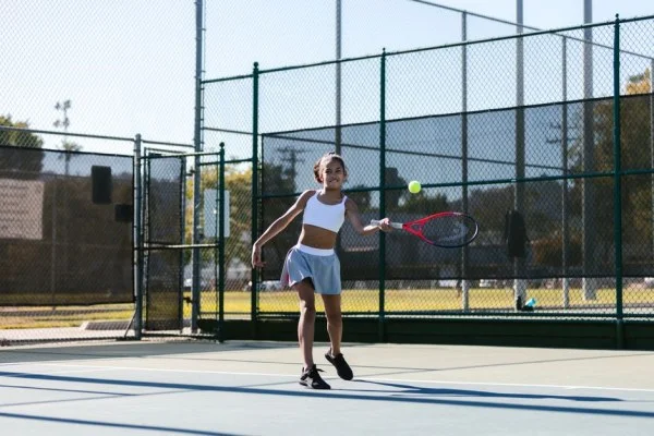 young athlete training tennis